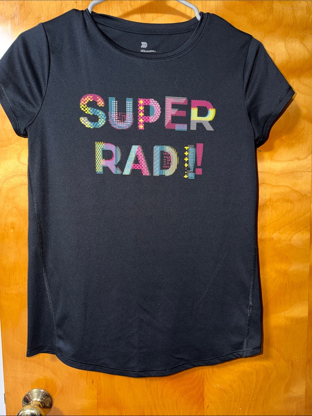 all in motion Black Tee with Multicolor "SUPER RAD!" Graphic